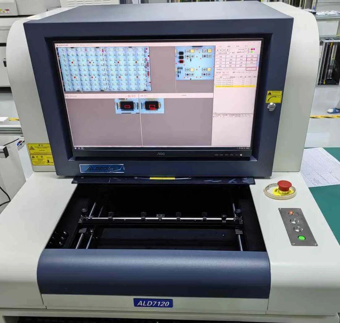 AOI machine scanning a board with flagged defects on screen