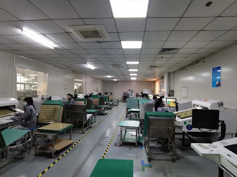 Inspection station checking assembled circuit boards at Hitech Circuits in Shenzhen