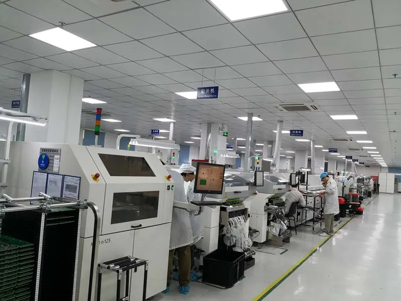 Hitech Circuits SMT assembly line in Shenzhen with pick-and-place machines and operators at the stations